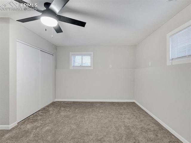 unfurnished bedroom featuring carpet, ceiling fan, and a closet