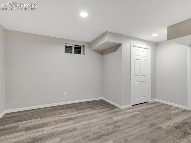 basement featuring light hardwood / wood-style flooring