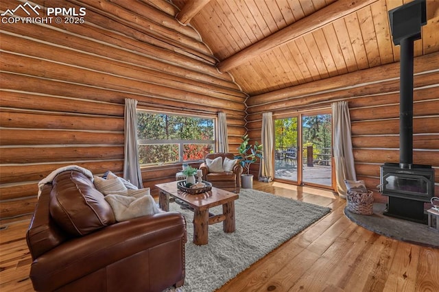 living room featuring wood ceiling, hardwood / wood-style flooring, beam ceiling, log walls, and a wood stove