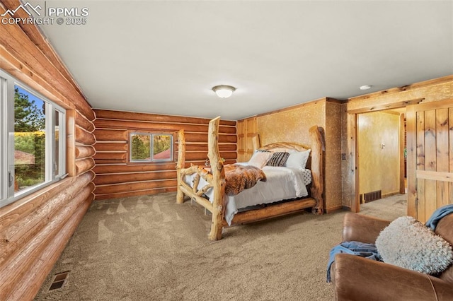 carpeted bedroom featuring log walls