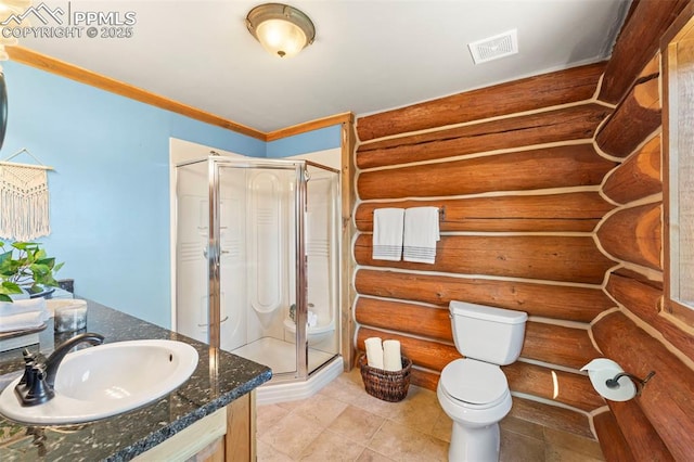 bathroom featuring toilet, ornamental molding, vanity, a shower with door, and log walls