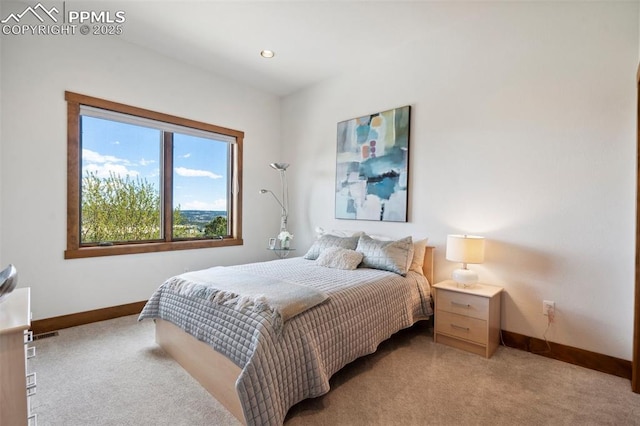 bedroom featuring light carpet