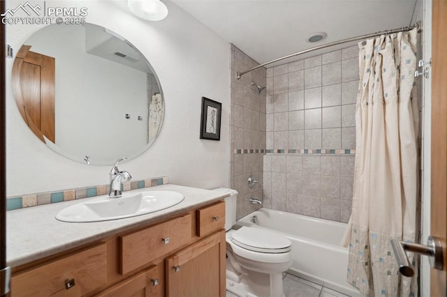 full bathroom with shower / tub combo, vanity, tile patterned floors, and toilet