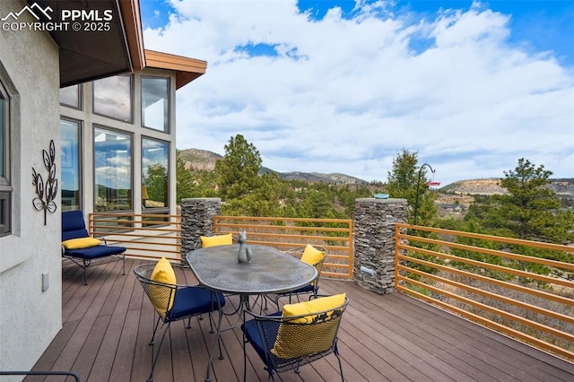 wooden deck featuring a mountain view