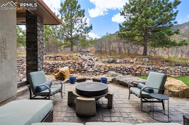 view of patio featuring a fire pit