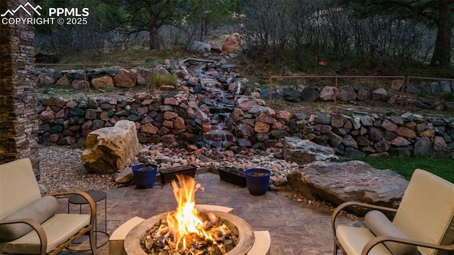 view of patio / terrace with an outdoor fire pit