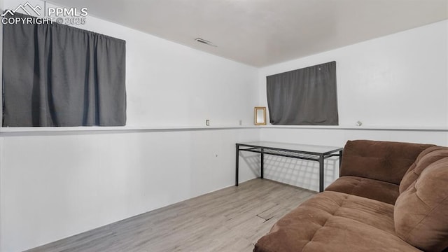 living area with light hardwood / wood-style floors