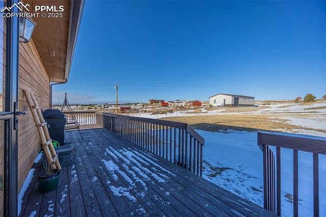 view of snow covered deck