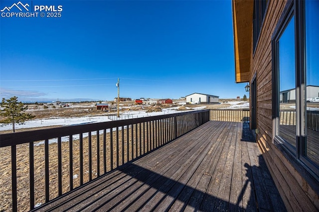 view of snow covered deck