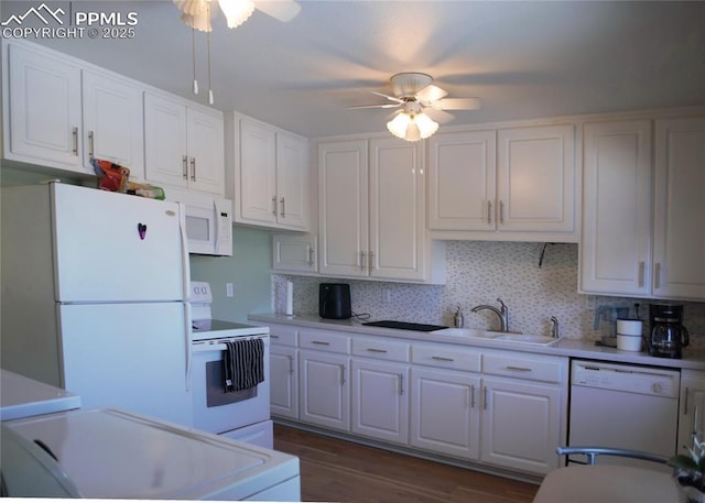 kitchen with white cabinetry, sink, white appliances, and ceiling fan