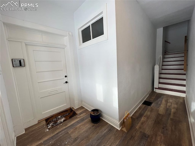 doorway to outside featuring dark hardwood / wood-style floors