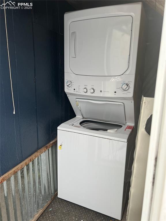 washroom with stacked washer and clothes dryer