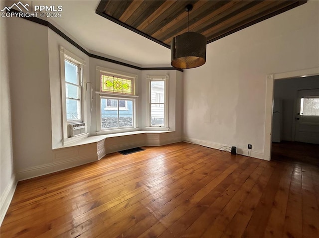 interior space with ornamental molding and wood-type flooring