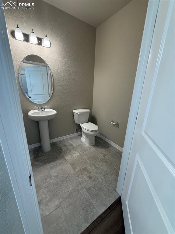 bathroom with sink and toilet