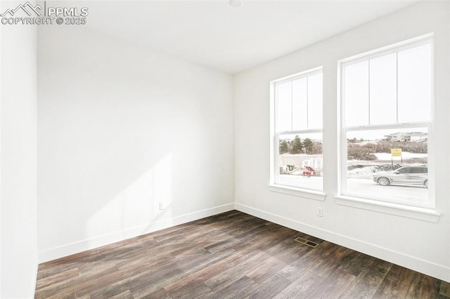 unfurnished room featuring hardwood / wood-style flooring