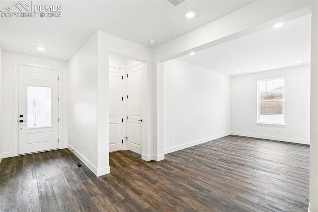 entrance foyer featuring dark hardwood / wood-style floors