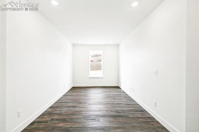 empty room with dark wood-type flooring