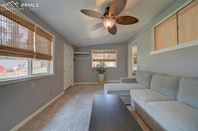 unfurnished living room with vaulted ceiling, an AC wall unit, light colored carpet, and ceiling fan