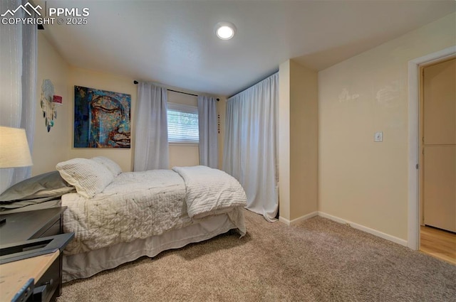 bedroom with light colored carpet