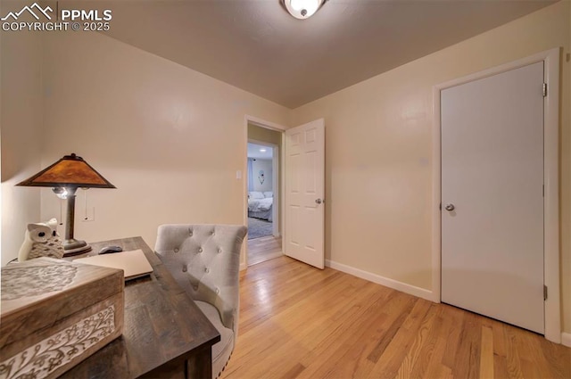 home office with light wood-type flooring