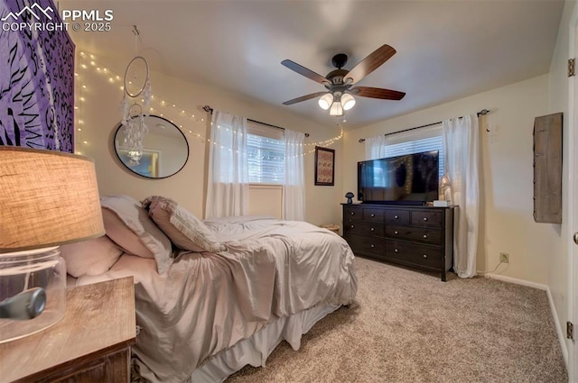 bedroom with ceiling fan and light colored carpet