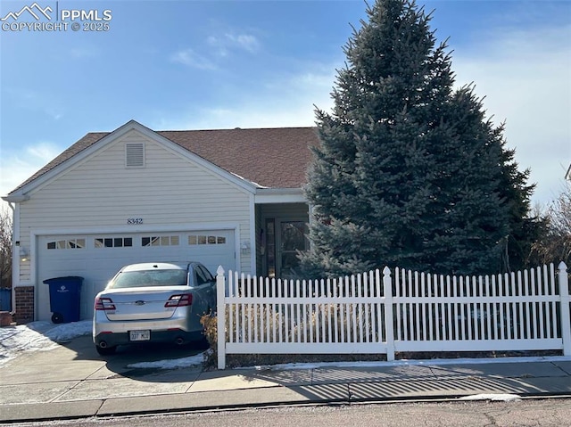 ranch-style house featuring a garage