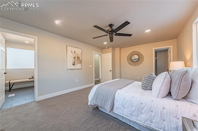 bedroom with ceiling fan, connected bathroom, and carpet floors