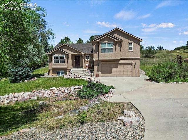 view of front of home featuring a garage and a front yard