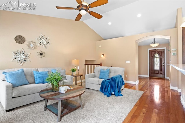 living room with lofted ceiling and hardwood / wood-style flooring