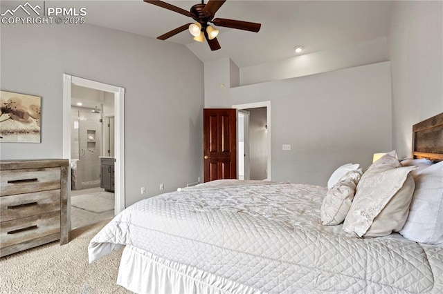 bedroom with ceiling fan, lofted ceiling, connected bathroom, and light carpet