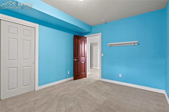 unfurnished bedroom featuring light colored carpet