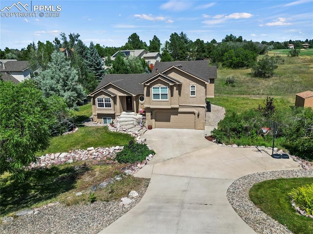 view of front of home featuring a garage and a front lawn