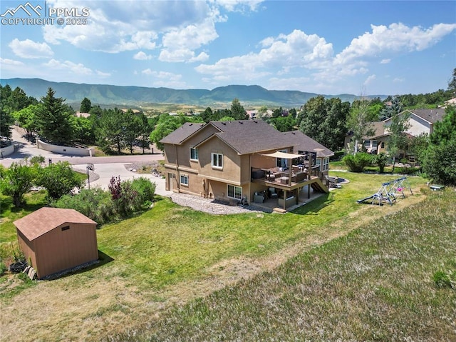 birds eye view of property with a mountain view