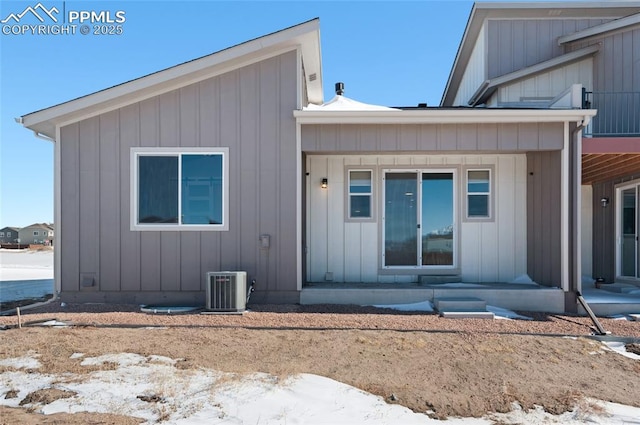 back of property featuring covered porch and central air condition unit