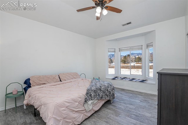 bedroom featuring ceiling fan and wood-type flooring