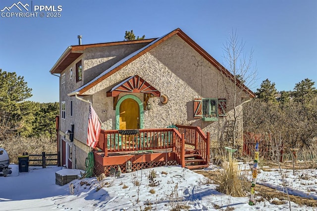 view of front of house with a wooden deck