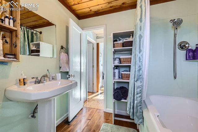 bathroom featuring wood-type flooring, shower / bath combo, and wooden ceiling