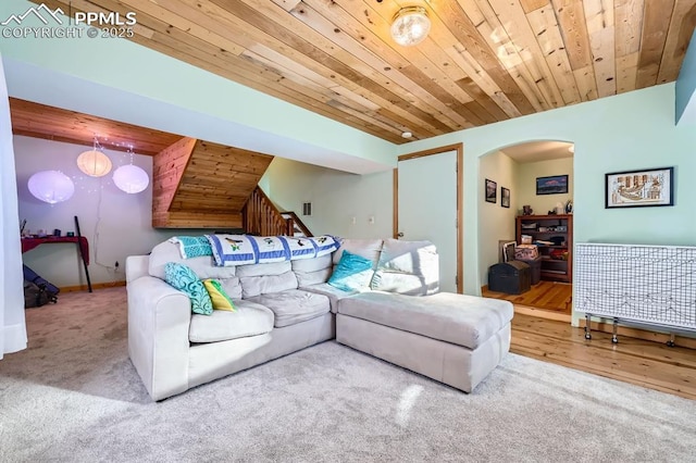 carpeted living room with wooden ceiling