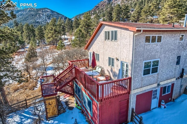 exterior space featuring a deck with mountain view