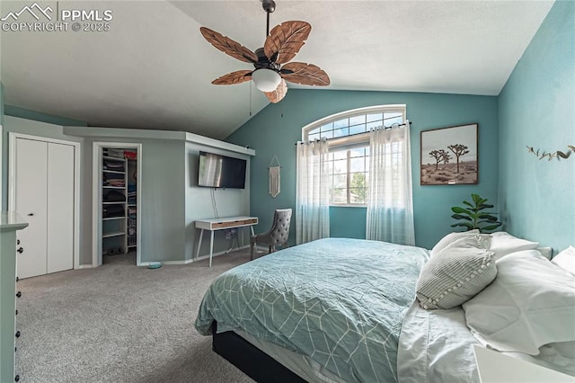 carpeted bedroom with vaulted ceiling and ceiling fan