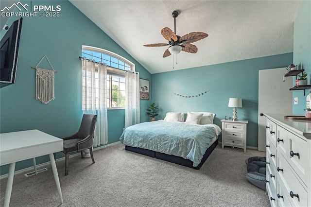 bedroom with lofted ceiling, ceiling fan, and carpet flooring