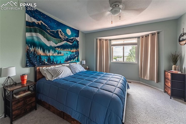 bedroom featuring ceiling fan and carpet