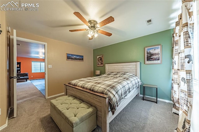 bedroom featuring ceiling fan and carpet