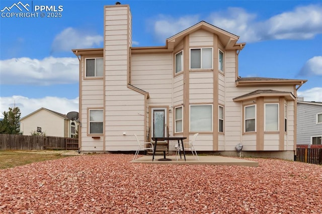 back of house with a patio