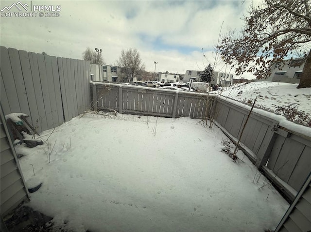 view of yard covered in snow