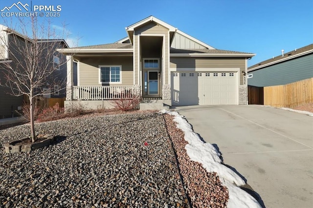 view of front of property with a garage and covered porch