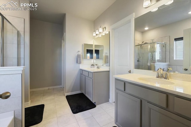 bathroom with vanity, tile patterned flooring, and a shower with shower door