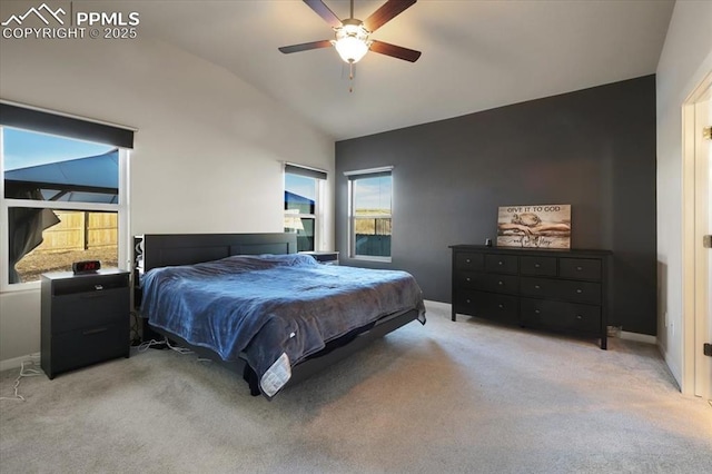 bedroom with high vaulted ceiling, light colored carpet, and ceiling fan