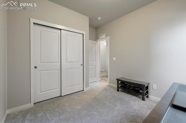 carpeted bedroom featuring a closet