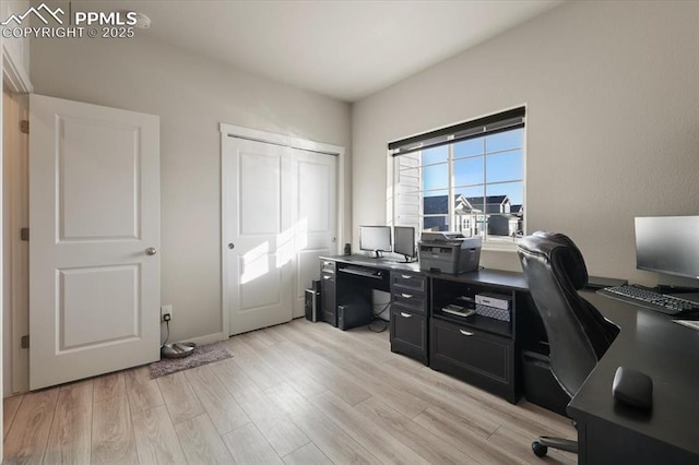 office space with light hardwood / wood-style flooring